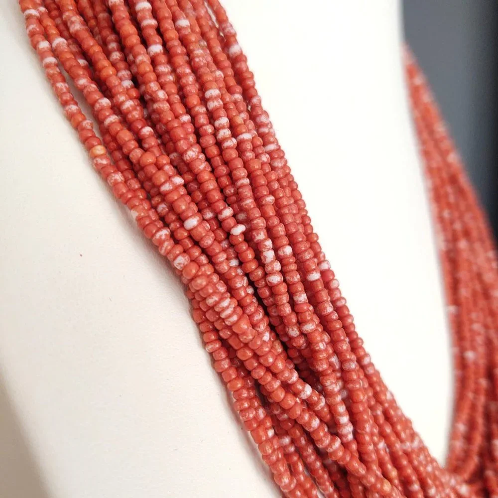 Orange and white multi strand seed bead necklace